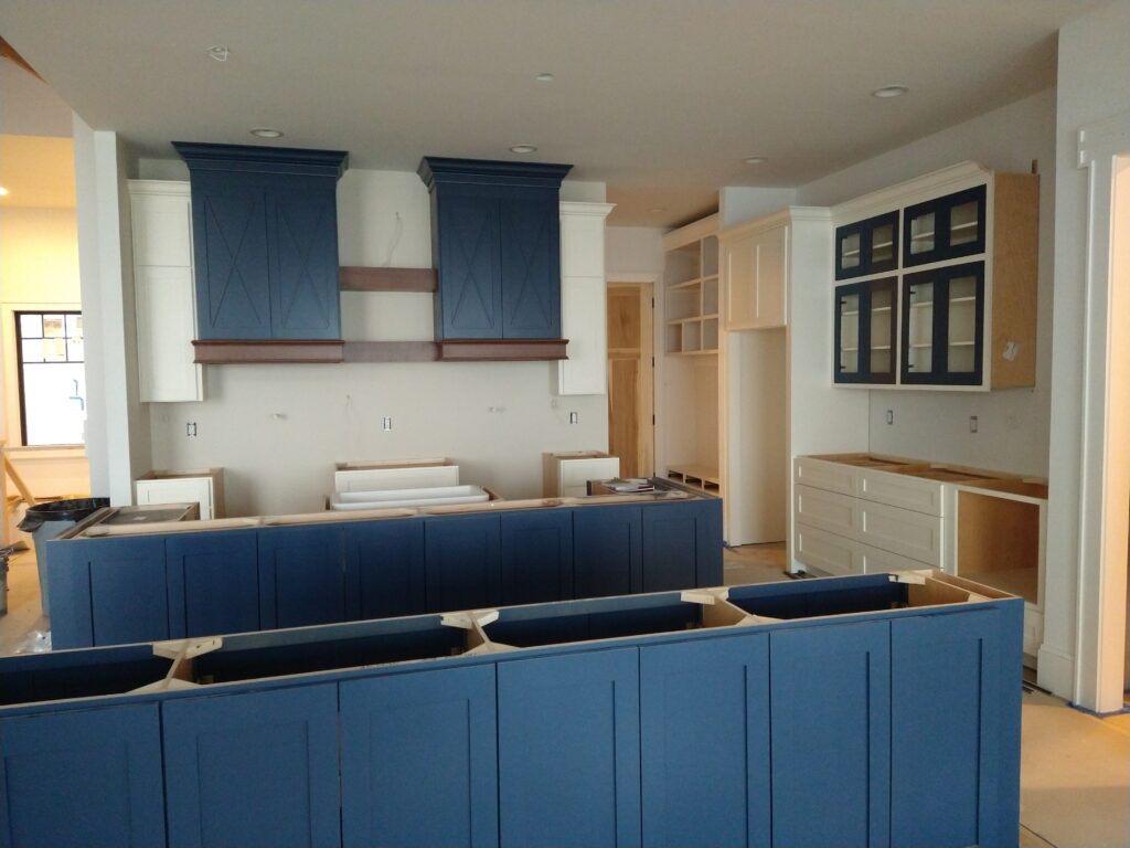 Modern Craftsman kitchen with double islands and double ranges.