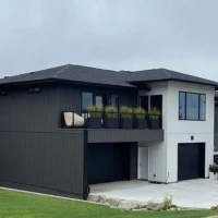 Modern prairie house charcoal and white modern house with balcony