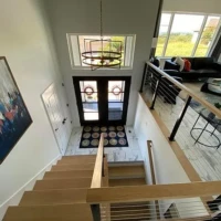 Modern prairie stairs and modern foyer